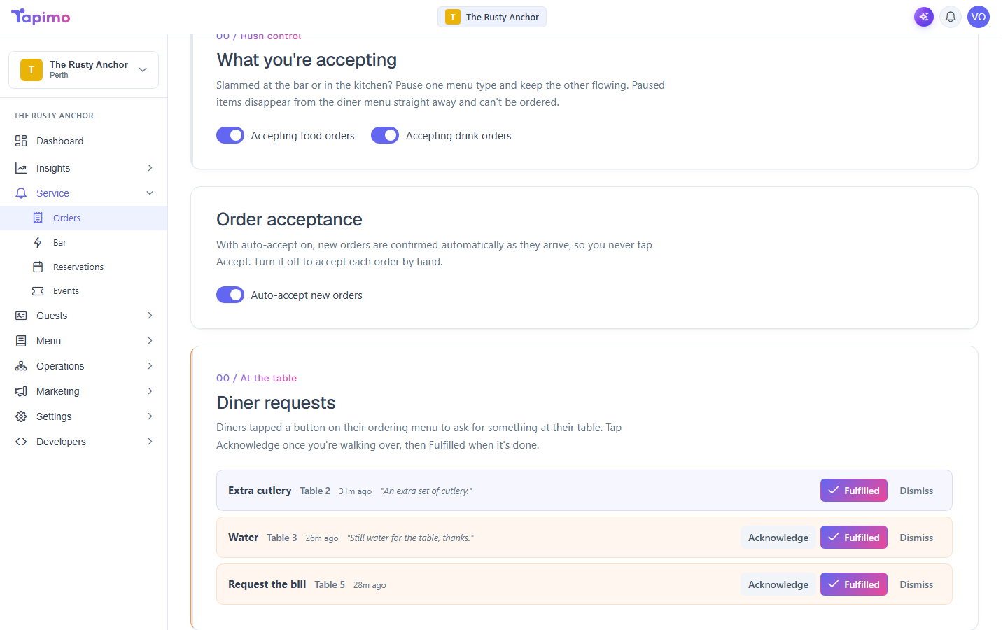 The Orders screen with the diner call-staff feed at the top, listing requests with Acknowledge and Fulfilled actions.